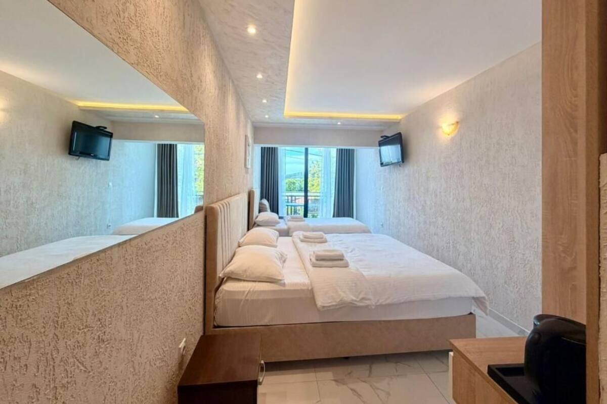 Deluxe Quadruple Room, Balcony | Minibar, soundproofing, cribs (free), WiFi (free)