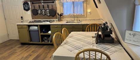 Fridge, microwave, stovetop, coffee/tea maker