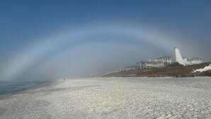A beach with a white building in the background. - NEW LISTING!!! QUIT 'N TIME - 5BD, LRG PRIV POOL & PATIO, WLK TO SEASIDE & BEACH (Santa Rosa Beach)