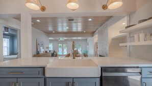 A modern kitchen with a large island, stainless steel appliances, and pendant lighting. - NEW LISTING!!! QUIT 'N TIME - 5BD, LRG PRIV POOL & PATIO, WLK TO SEASIDE & BEACH (Santa Rosa Beach)