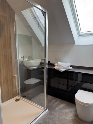 Shower, hair dryer, towels, soap