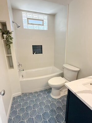 Shower, hair dryer, towels, soap