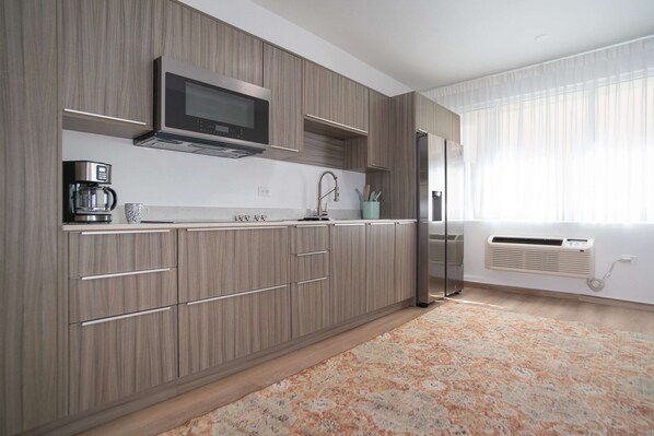 Fridge, microwave, stovetop, coffee/tea maker