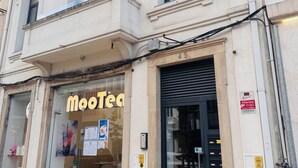 A building with a shop named "MooTea" on the ground floor.