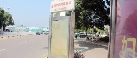A taxi stand with a sign indicating it's for taxis.