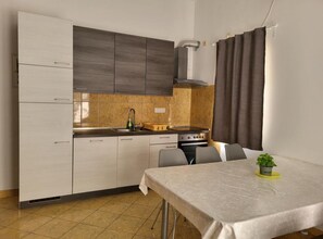 Apartment (Two-Bedroom Apartment With Terrace An) | Private kitchen | Fridge