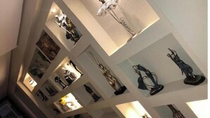 A multi-level atrium with various sculptures and artwork displayed on the walls and ceiling. - 3 bedrooms Duplex 90 st. parkmall residence (New Cairo City)