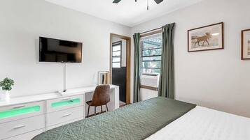 1 bedroom, desk, iron/ironing board, travel crib