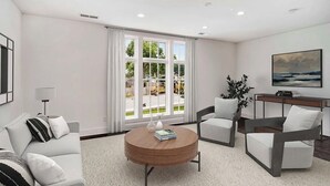 Ein modernes Wohnzimmer mit einem runden Holztisch, zwei Sesseln, einem Sofa und einem großen Fenster mit Vorhängen.
