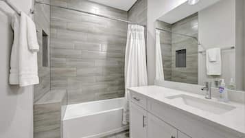 Shower, hair dryer, towels, soap