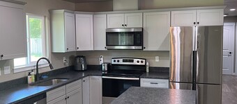 Spacious 4 bedroom 2 bath house across from the Rogue River with big fenced yard