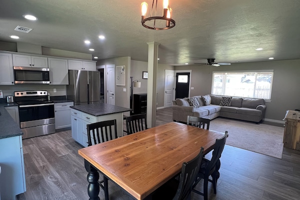 Comfortable seating for the whole group. Five chairs at the table, two barstools