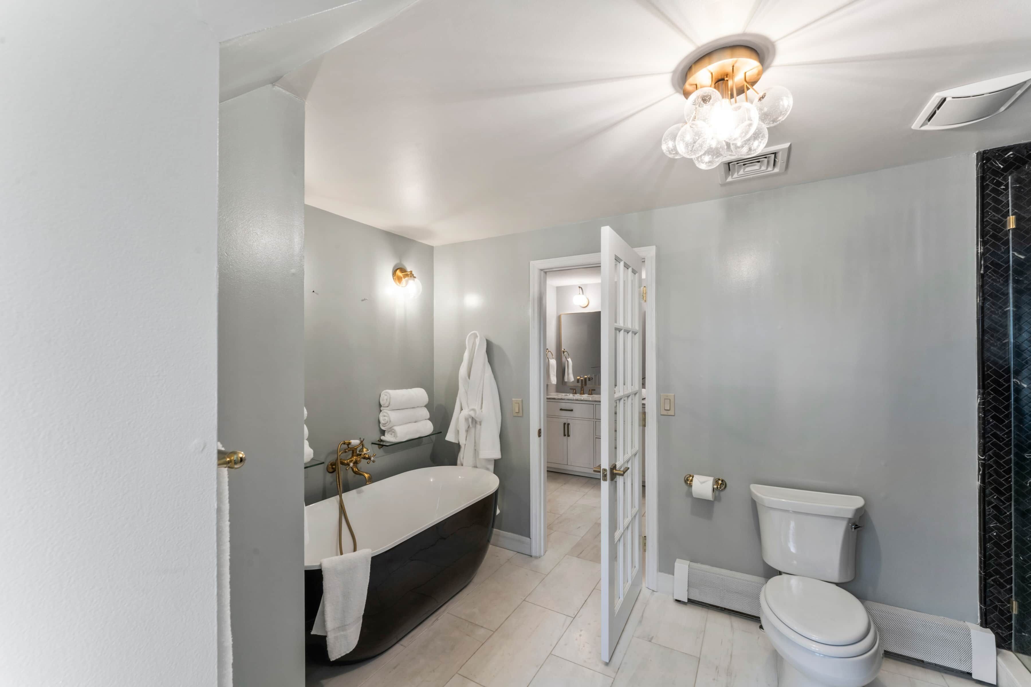 Shower, jetted tub, hair dryer, towels
