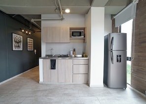 Fridge, microwave, stovetop, coffee/tea maker