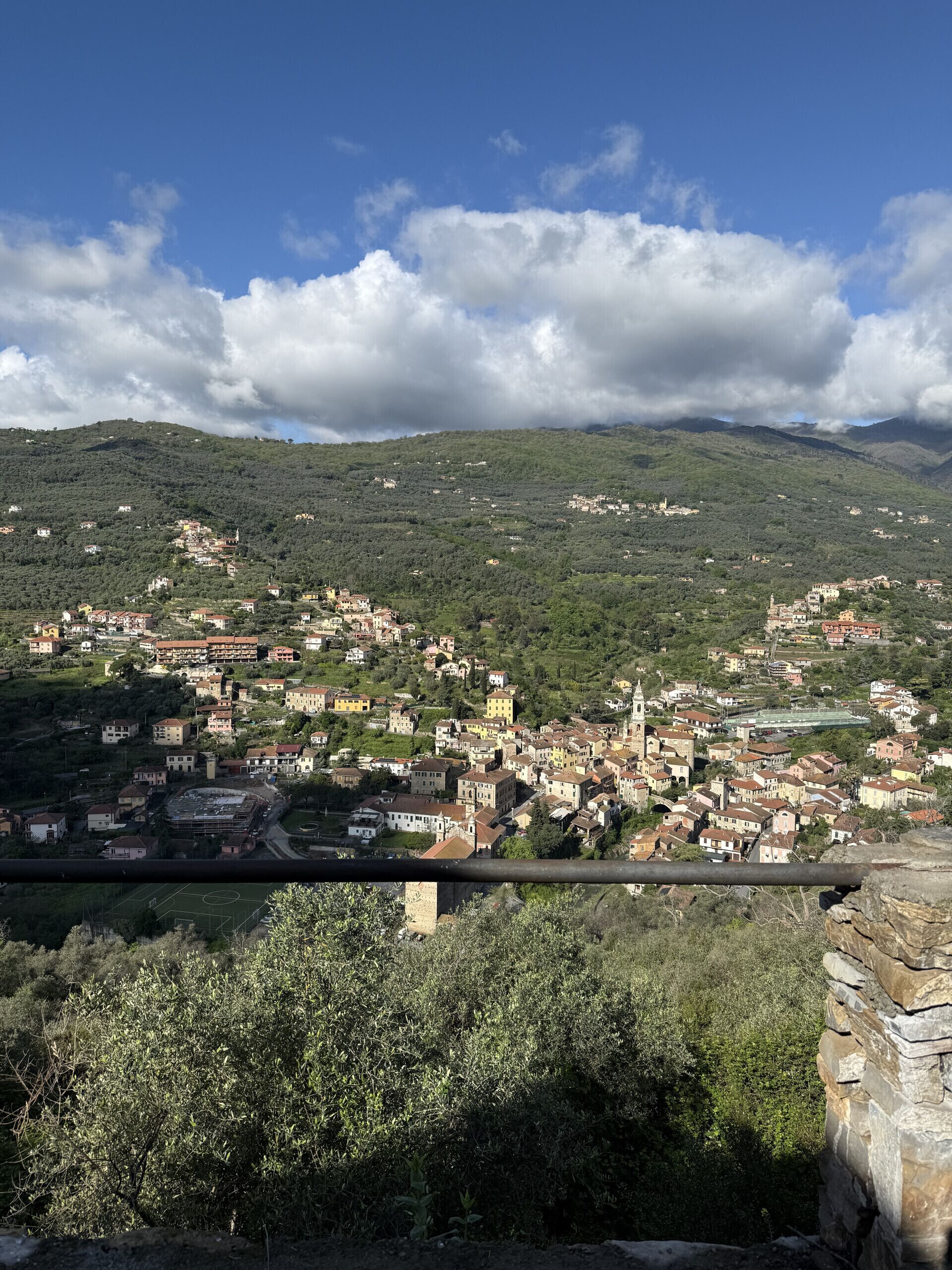 A town with a prominent church and a bridge in the foreground.