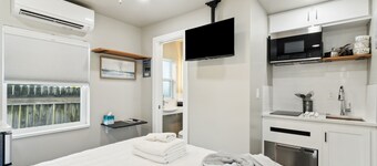 Luxury Studio Steps to Beach Kitchenette Outdoor Seating Partial View Upstairs