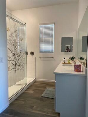 Shower, hair dryer, towels, soap