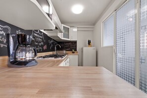 Apartamento ejecutivo, balcón, vistas a la ciudad | Cocina privada