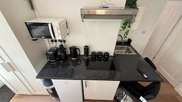 Fridge, microwave, stovetop, coffee/tea maker