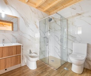 Bidet, towels, soap, toilet paper