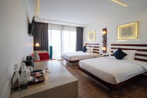 A hotel room with two beds, a desk with a coffee machine, and a TV mounted on the wall. - Angkor Breeze Hotel & Spa (Siem Reap)