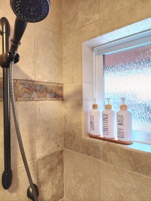 Shower, hair dryer, towels, soap