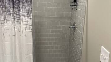 Shower, towels, toilet paper