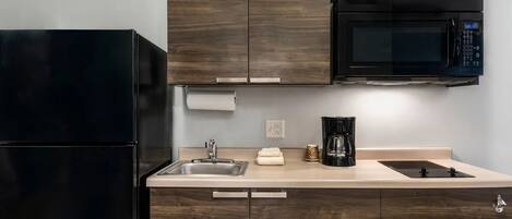Fridge, microwave, stovetop, coffee/tea maker