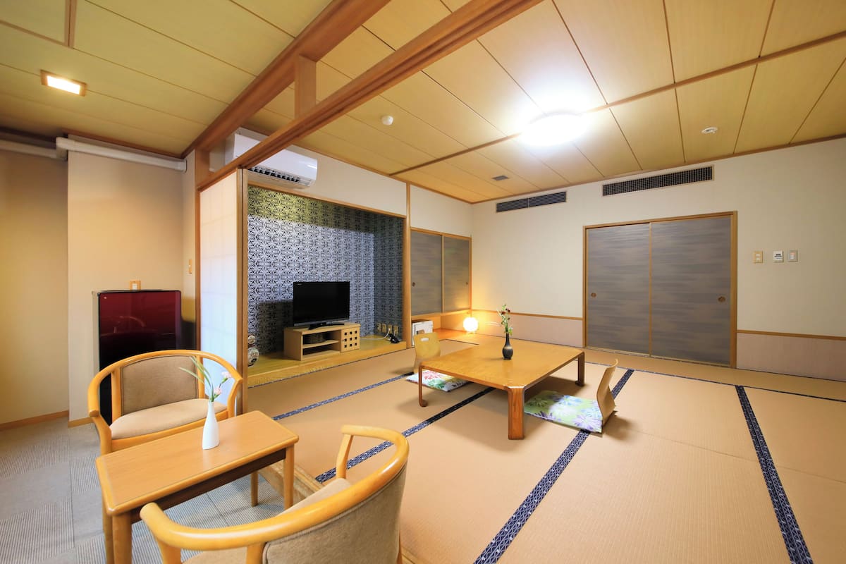Basic Quadruple Room, Non Smoking, Garden View | In-room safe, iron/ironing board, free WiFi, bed sheets