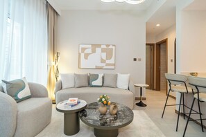 55-inch Smart TV with cable channels - Designer 1BR Apt Fully Equipped (Dubai)