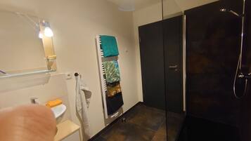 Shower, towels, soap, toilet paper