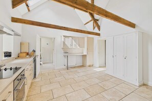 Enjoy cooking in this well-equipped kitchen with a stove, oven, and large countertop.