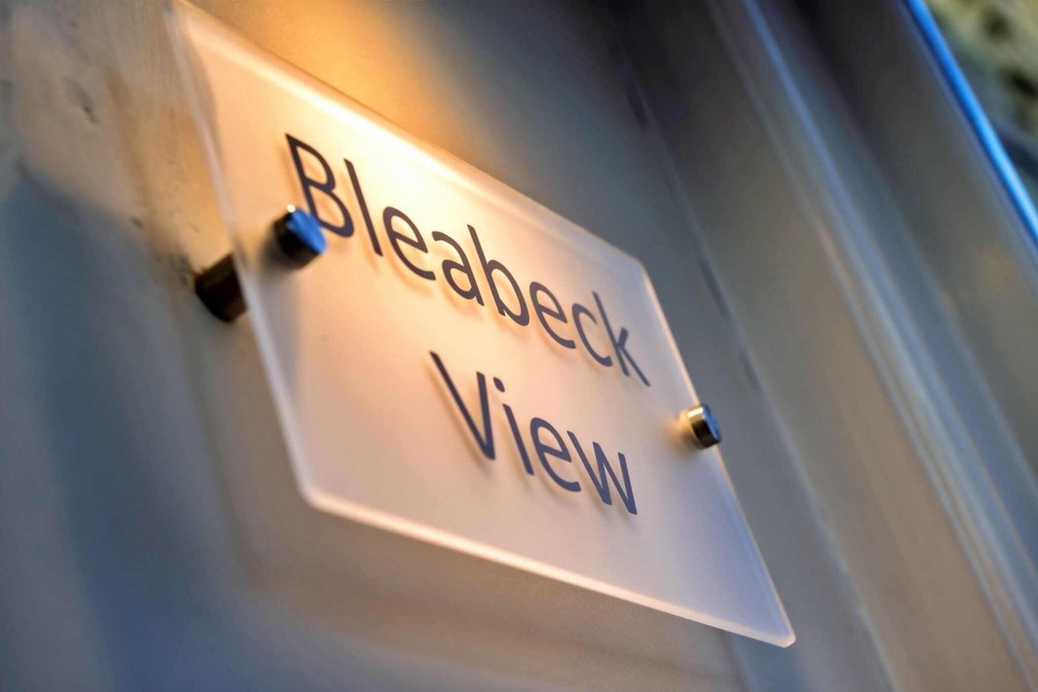 A sign with the text "Bleabeck View" mounted on a wall.