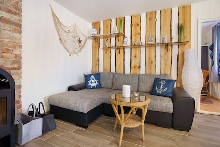 TV, fireplace. Bungalow 'Karsten' with Private Terrace and Private Garden