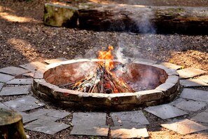 Enjoy a warm gathering around the fire pit in the outdoor space.