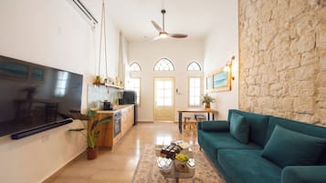 Apartment, Private Pool | Living area | 65-inch Smart TV with cable channels