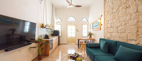 Apartment, Private Pool | Living area | 65-inch Smart TV with cable channels