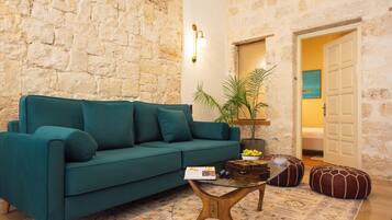 Apartment, Private Pool | Living area | 65-inch Smart TV with cable channels