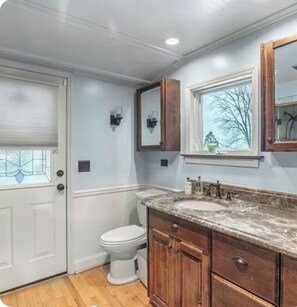 Shower, jetted bath, towels, soap