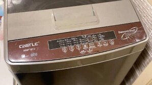 A Castle WMF1612 washing machine with a control panel and a transparent door. - Cozy Modern Apartment in El Rehab 2, (Cairo Governorate)