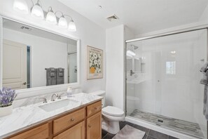 Shower, hair dryer, towels