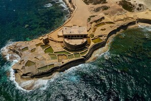An aerial view of a coastal fort with a central courtyard, surrounded by walls and a beach. - Sea & Valley Views Żebbuġ Gozo (Zebbug)