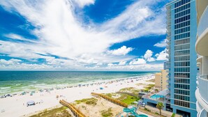 A resort with a beach, a pool area, and a high-rise building. - Phoenix Gulf Shores Ii 705 4 Bedroom Condo (Gulf Shores)