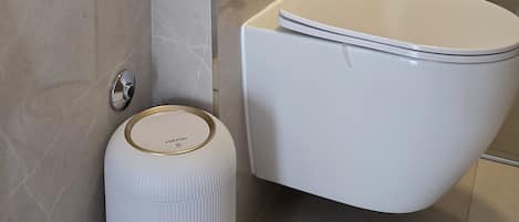 Hair dryer, towels, soap, toilet paper