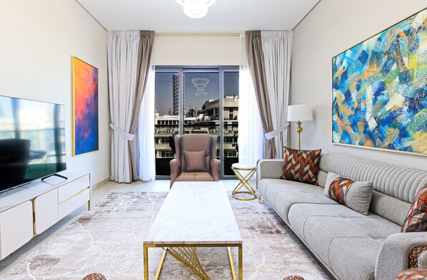 55-inch Smart TV with cable channels - Spacious 2BR Apt Maids Elegance (Dubai)