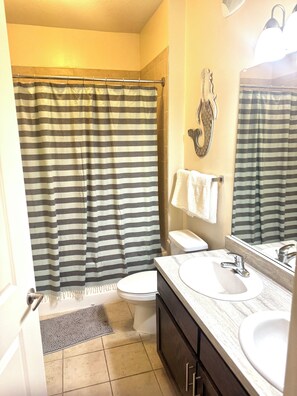 Shower, towels, soap, toilet paper
