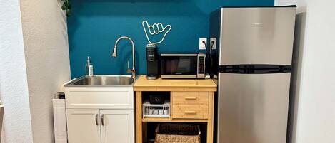 Microwave, coffee/tea maker, cookware/dishes/utensils, paper towels