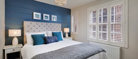 Departamento | 2 habitaciones y tabla de planchar con plancha