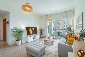 Luxury Apartment, City View | Living area | 55-inch Smart TV with cable channels - Vogue | Al Alka Greens near Mall of the Emirates (Dubai)