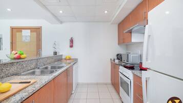 Luxury Apartment, City View | Private kitchen | Full-size fridge, microwave, oven
